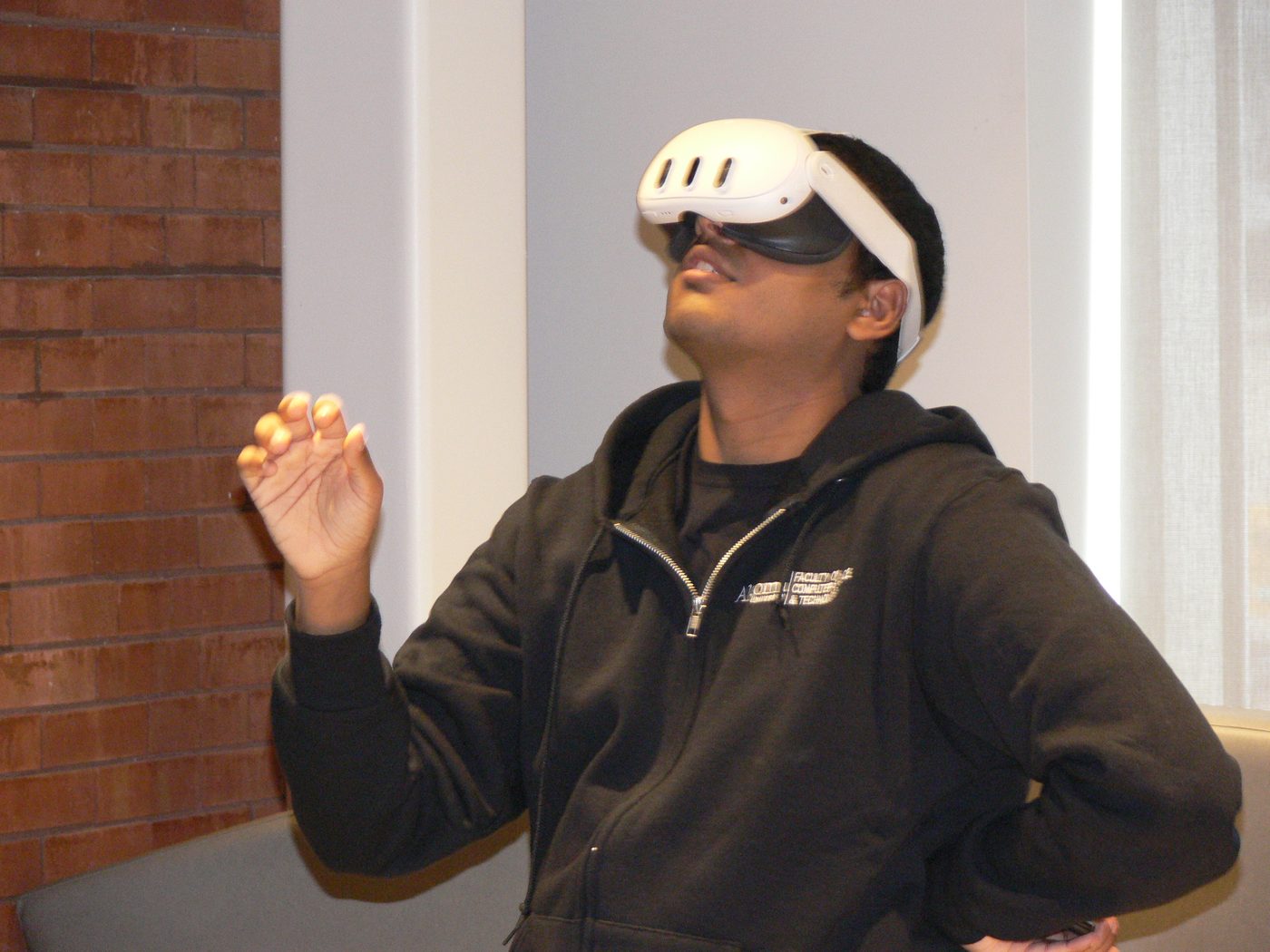 A participant trying a VR headset at ThunderHacks, March 2026